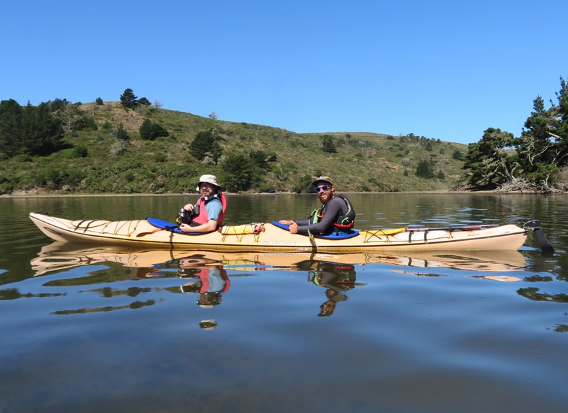 Alex on kayak with guide