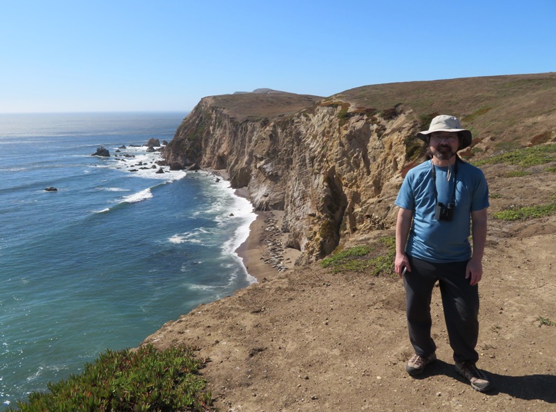 Alex with seals in the distance