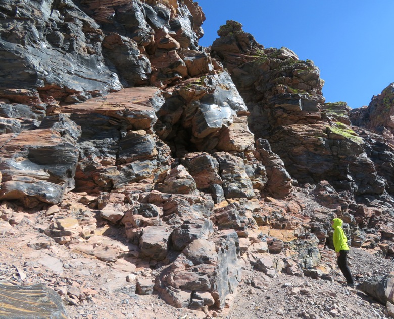 Norma looking up at obsidian stones