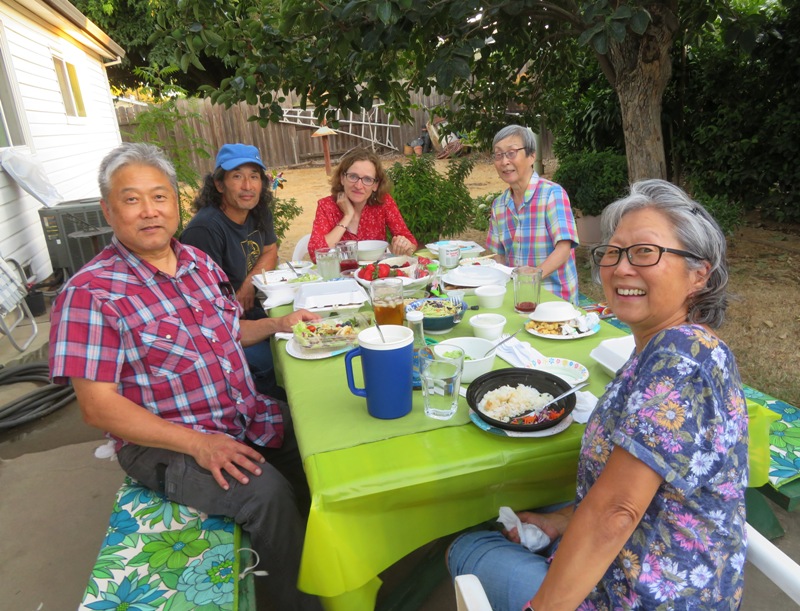 Group of us seated in the backyard for dinner