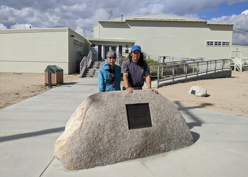 Mom and me behind rock with national historic landmark plaque