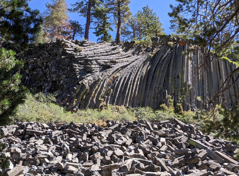 Columns of basalt rock, some bent