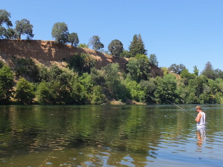 People swimming and fishing