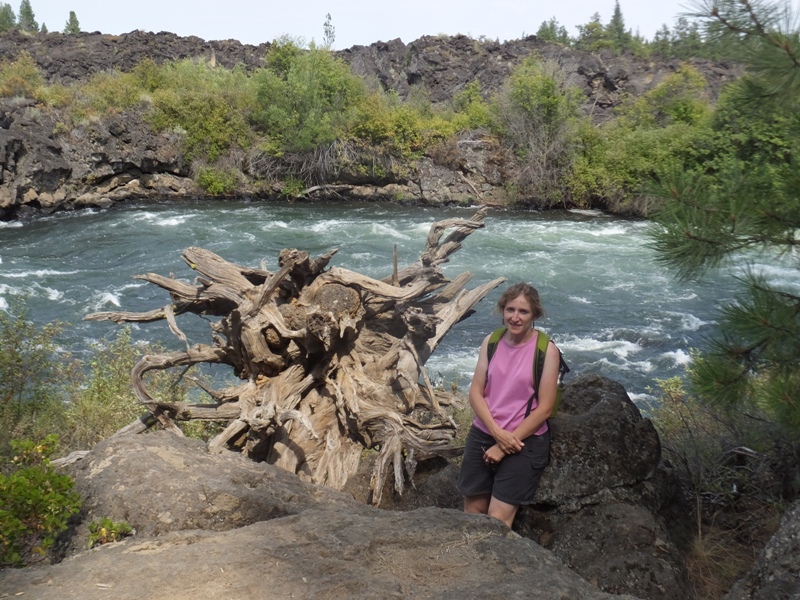 Norma standing in front of a whitewater section of the river