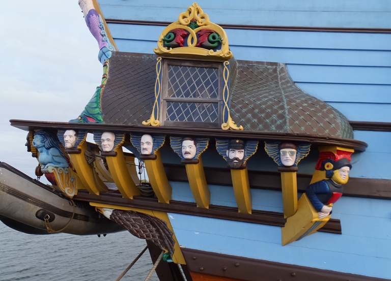 Faces carved into the back side of the ship