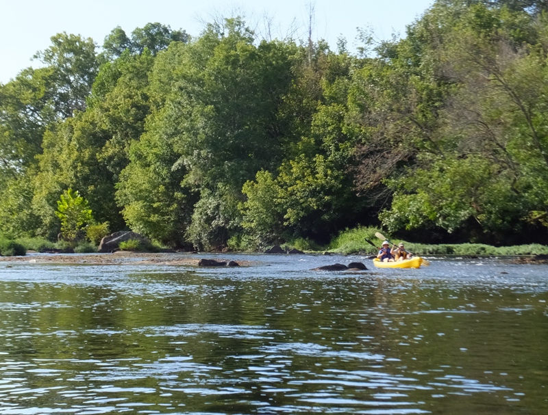 Norma and Janett kayaking on riffles