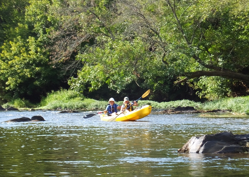 Janett high above the water because the boat is stuck on a rock