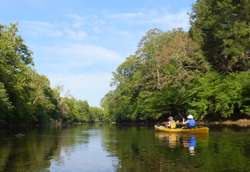 Norma and Janett kayaking on flat water