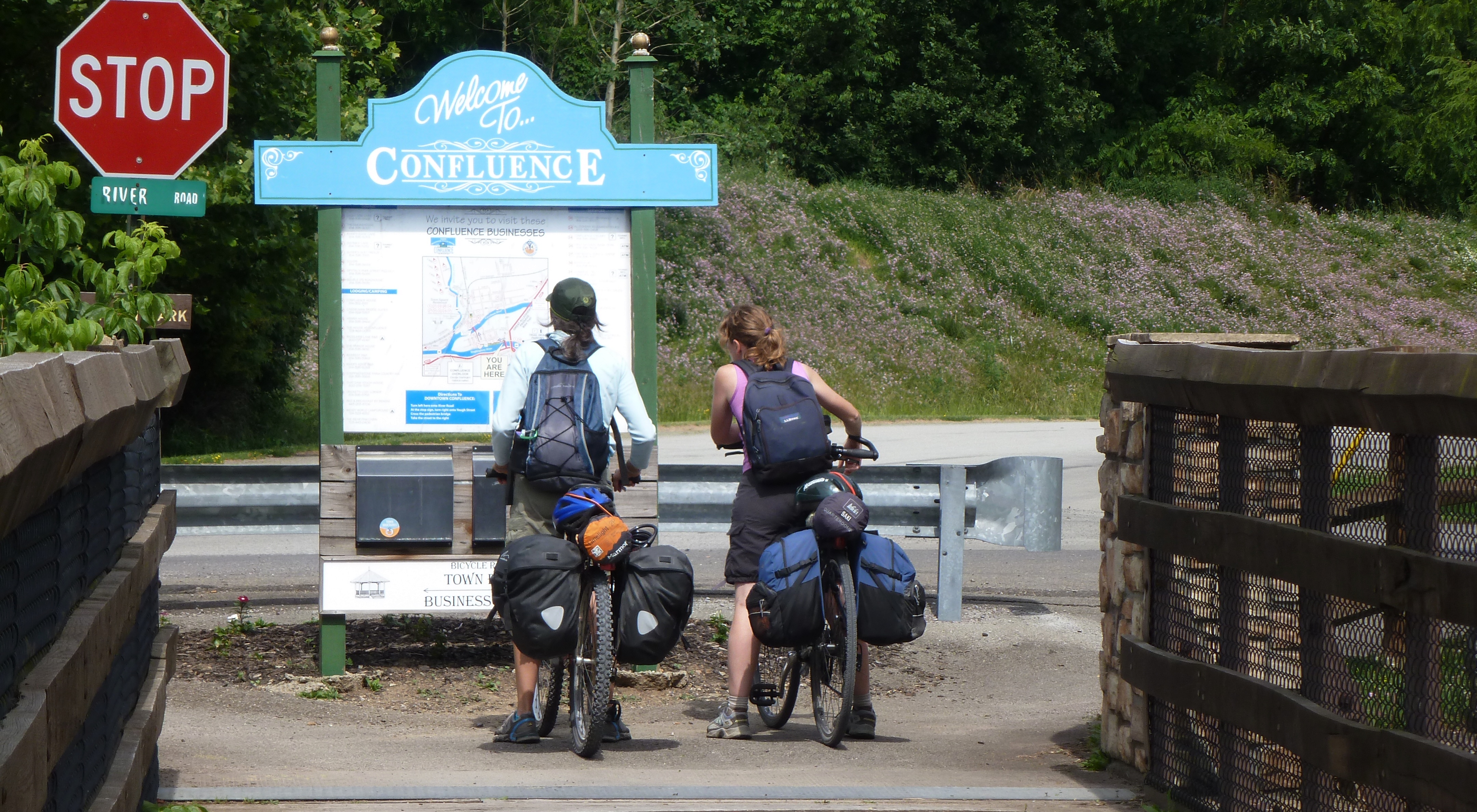 Norma and Carmen stopping to read a trail sign in Confluence