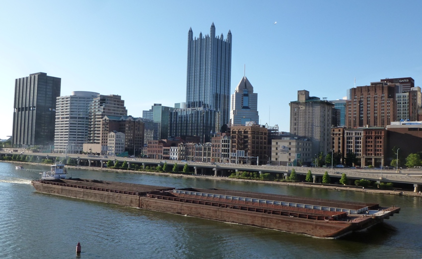 Barge on the river with skyline behind