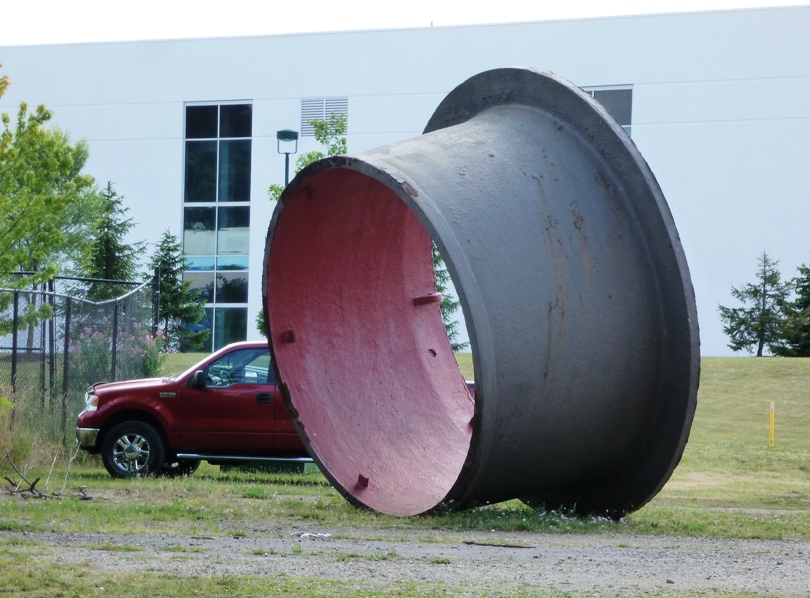 Big tubular object in front of truck