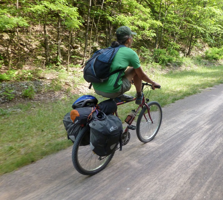 Carmen riding with both feet on her horizontal frame bar