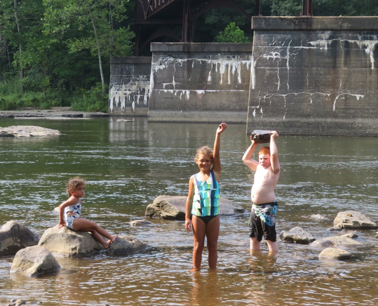 Kids holding up rocks