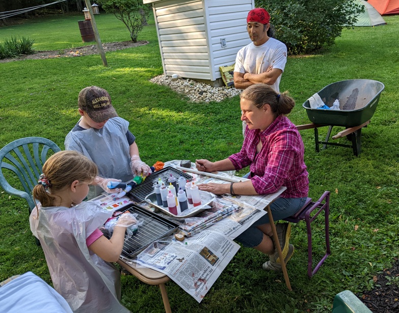 Group of us putting dye on clothes