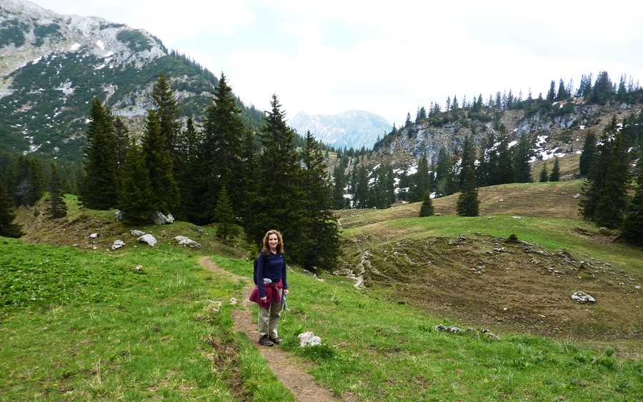 Norma on trail with mountains behind