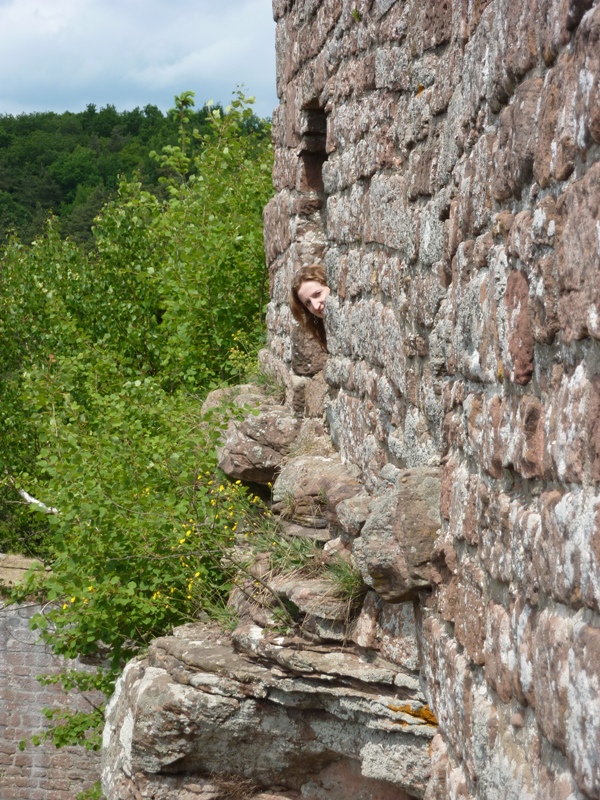 Norma looking out window of castle