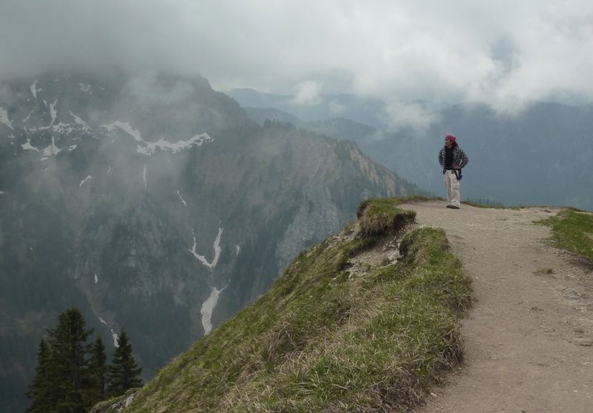 Me in the clouds standing on a level area in the Alps