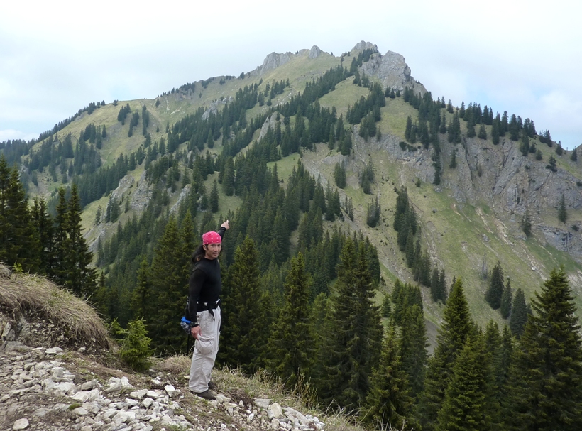 Me pointing to the peak we climbed with the cross