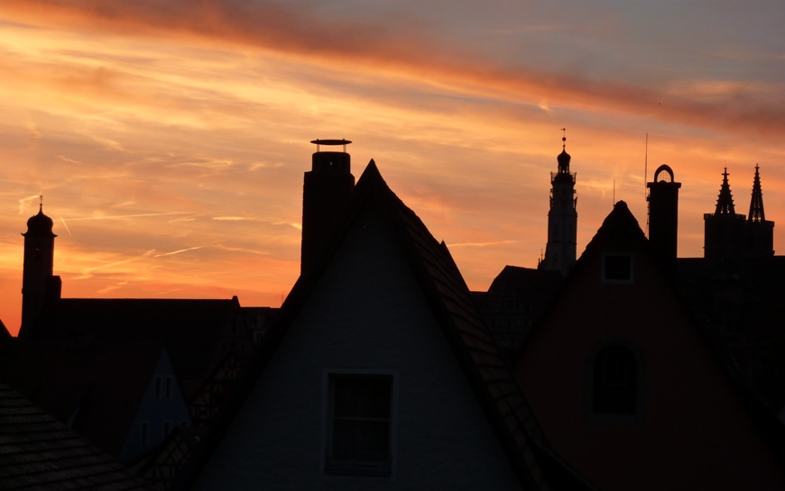 Red sky sunset over old buildings