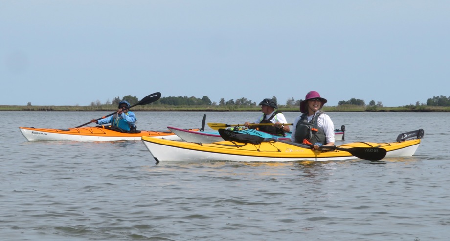 Three kayakers