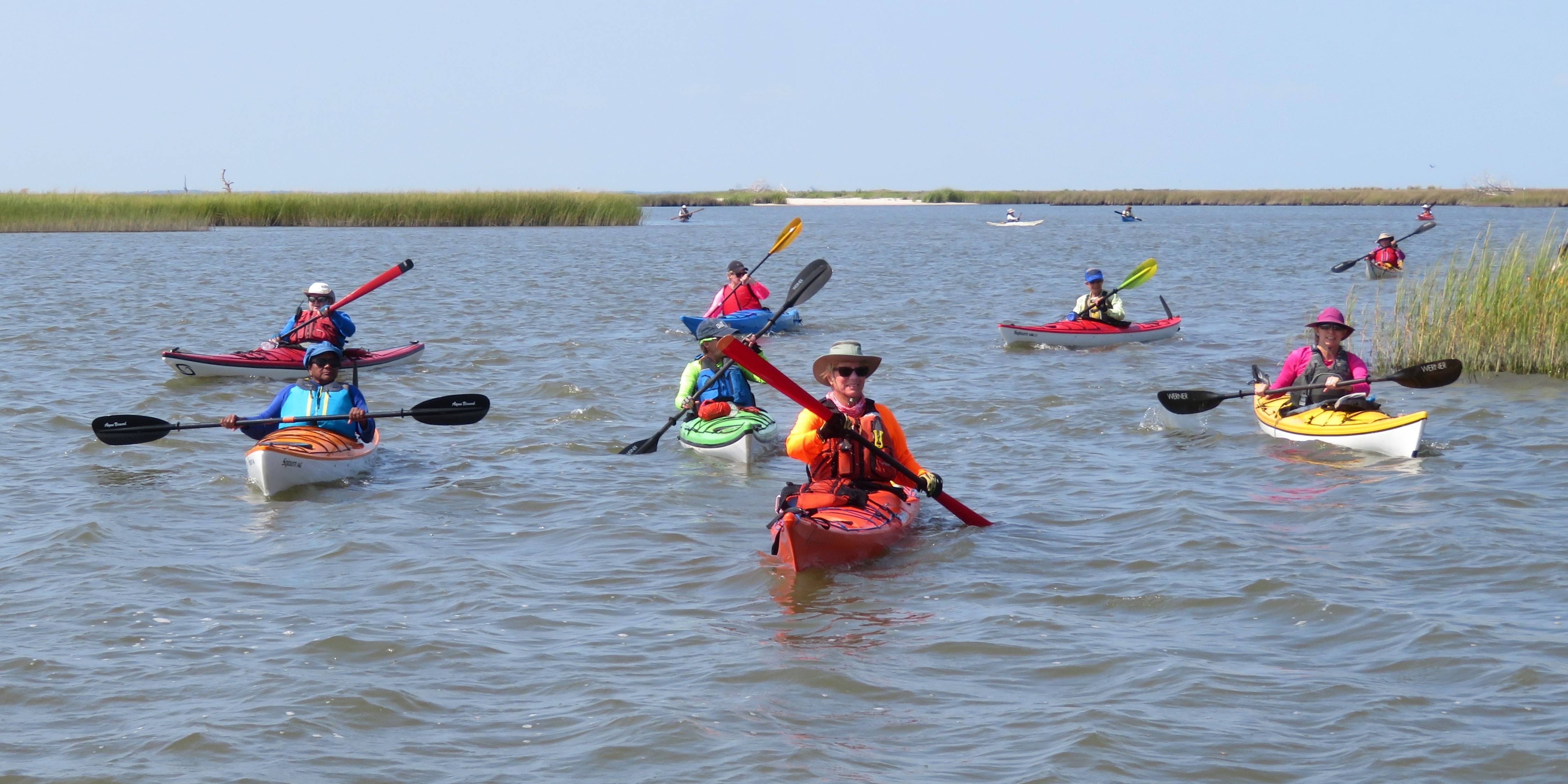 Group of kayakers paddling