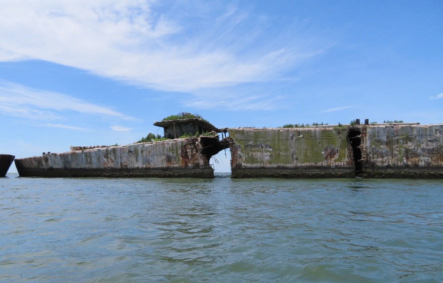 Side view of ship with hole in it