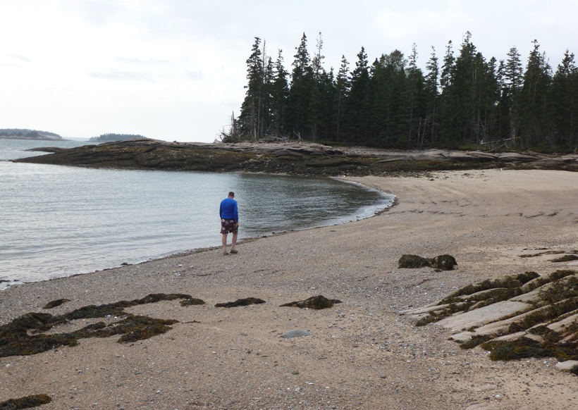 Vince walking to the island on a section that will be underwater in another hour