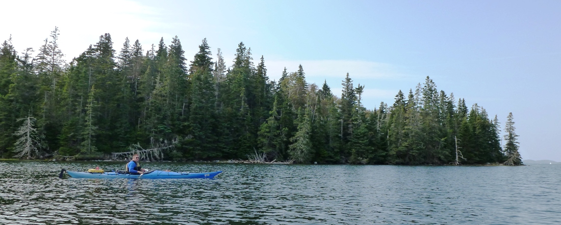 Vince in kayak with Carney Island in background