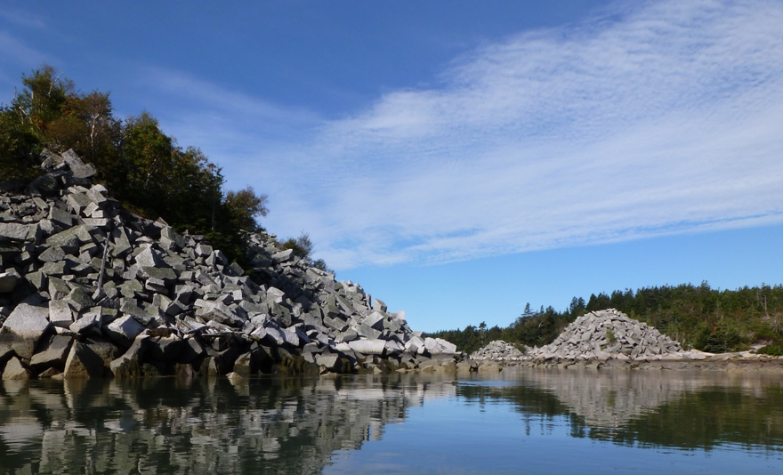 Big cut pieces of granite come right up to the calm, protected waters