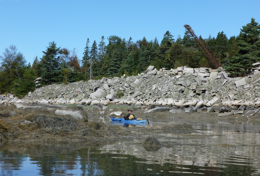 Vince with seaweed, granite, crane (machine, not bird) holding an osprey nest