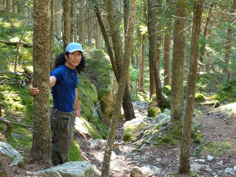 Me grabbing a tree on the trail