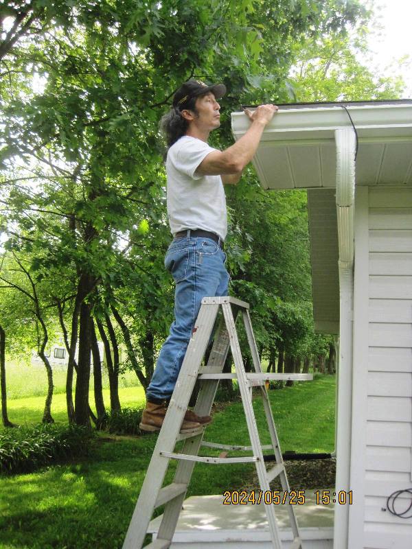 Me inspecting roof gutters