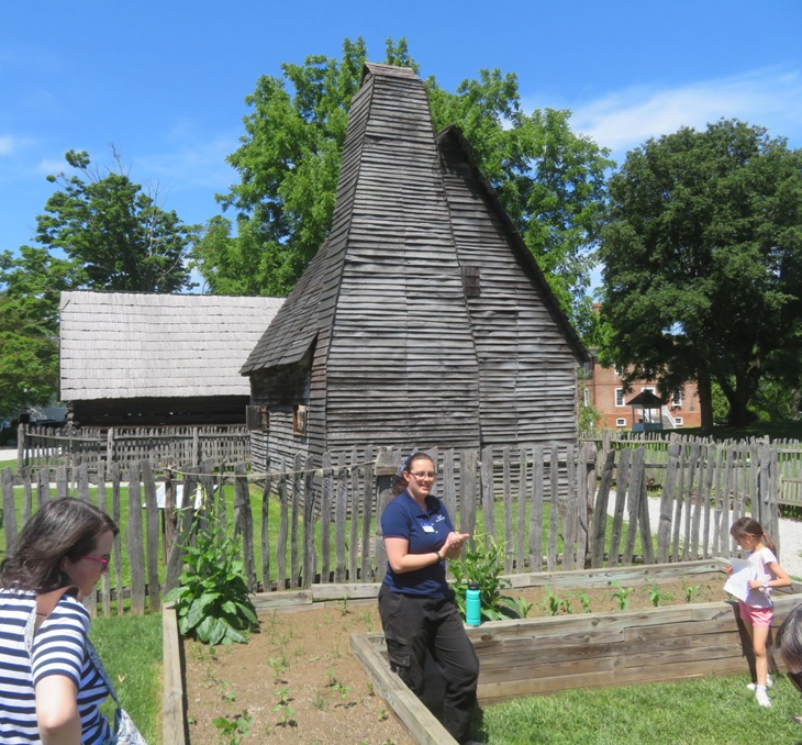 Tour guide in front of Lord Mayor's Tenement, an old, wooden reconstruction house