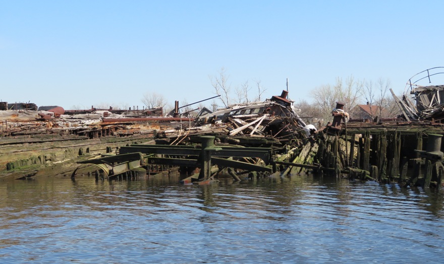 Half sunken boat with the bow sticking out of the water