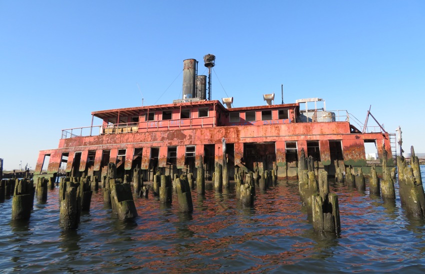 Piles in front of red boat