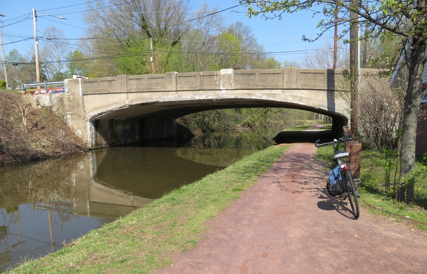 Bicycle, trail, canal, and bridge