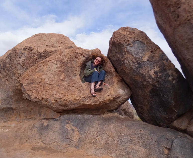 Norma using a boulder indentation as a chair