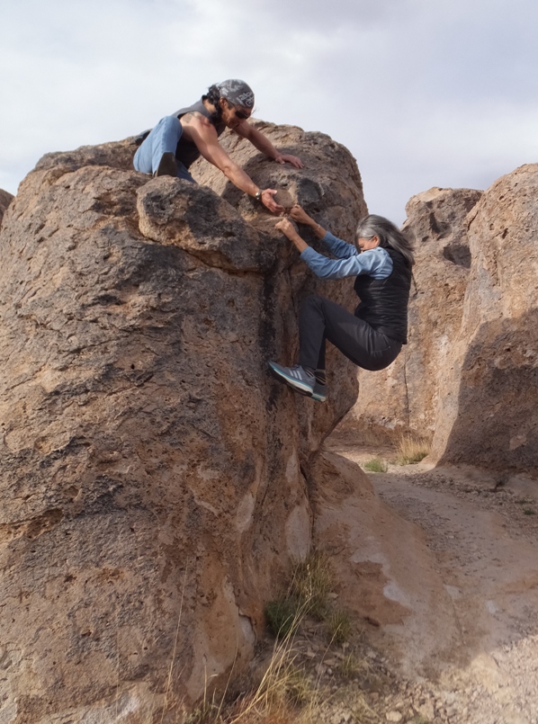 Me helping Carmen climb a boulder