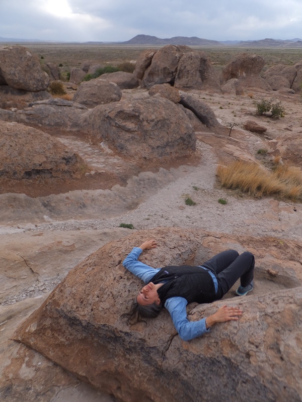 Carmen lying on a rock