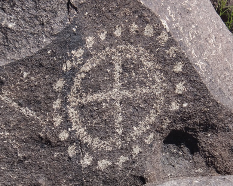 Petroglyph with crosshairs and dots all around