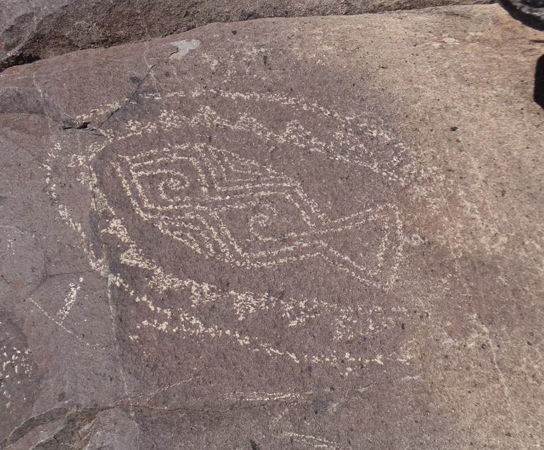 Petroglyph of a decorative bomb or fish