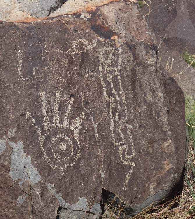 Petroglyph of a hand and a snake