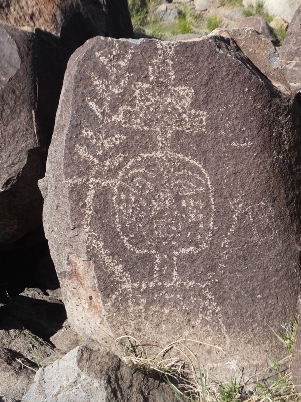 Petroglyph of man wearing Devo hat