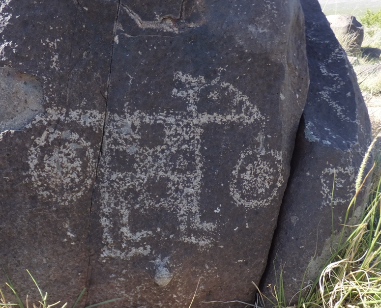 Petroglyph of dog with the Purina symbol as its body