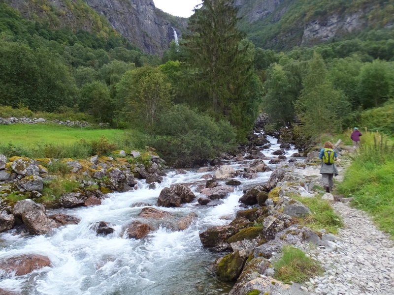 Norma and Carmen on trail by rushing whitewater