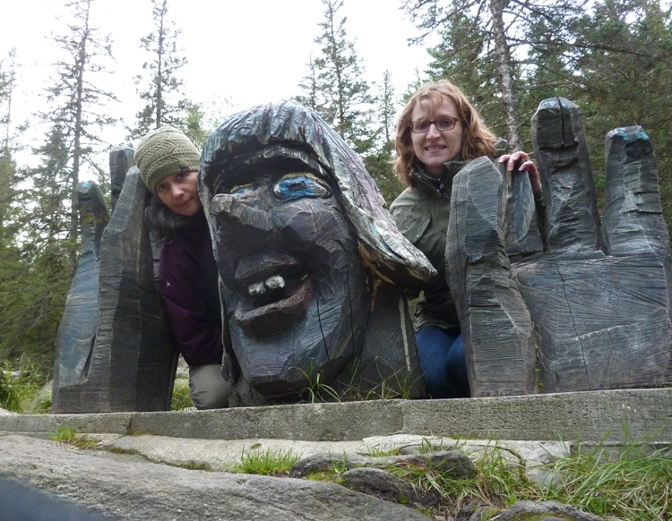 Carmen and Norma with troll statue having giant hands