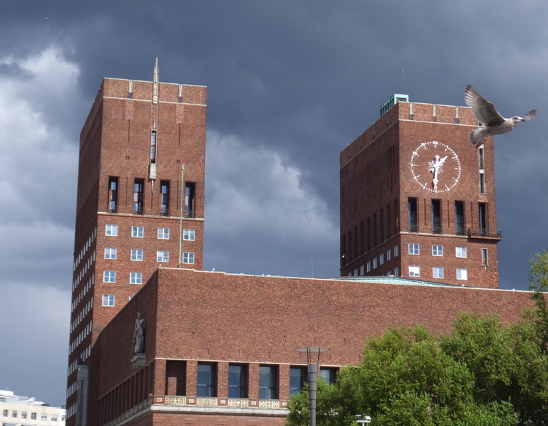 Two Carillon towers with bird flying in front