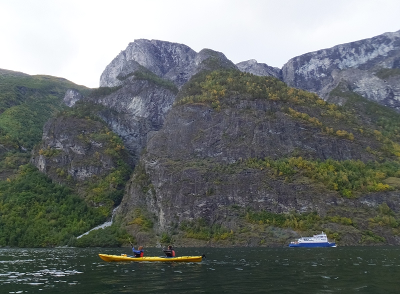 Kayakers and tour boat