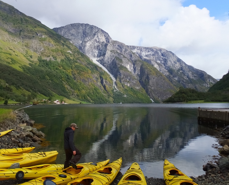 Kayaks lined up on the shore