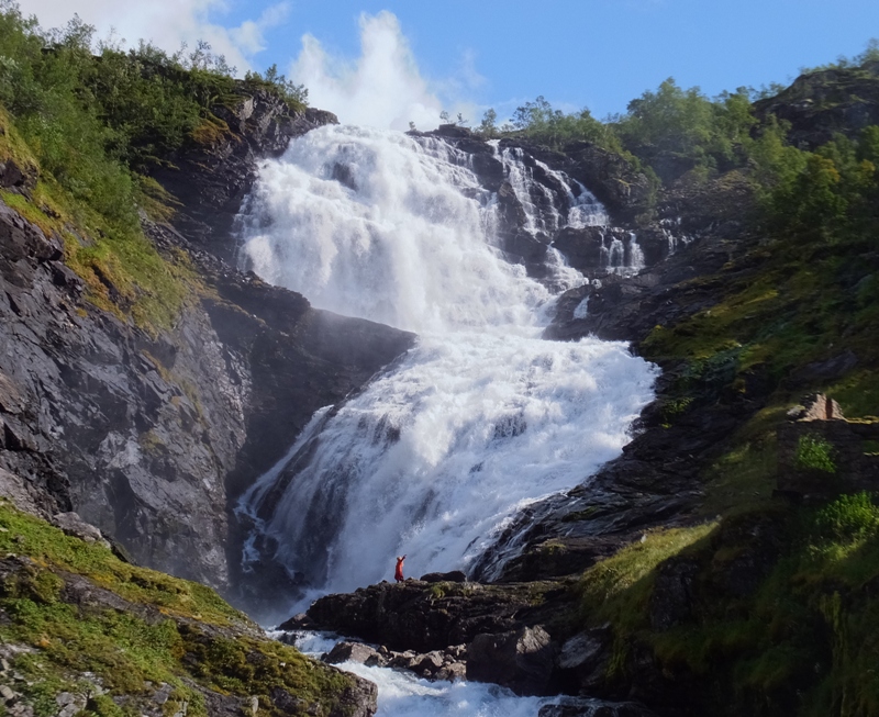 Big waterfall with dancer